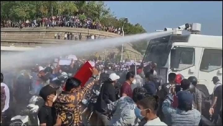 Myanmar coup protesters targeted by water cannons as military threatens legal crackdown, orders curfew